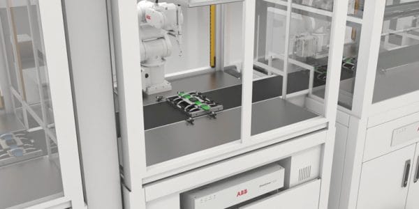Vit ABB industrirobot i en robotcell från JE robotteknik och automation